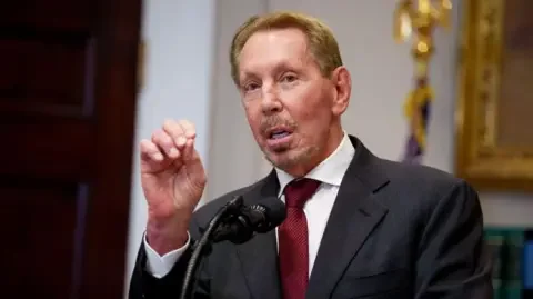 Getty Images Oracle co-founder Larry Ellison gesturing while making a speech before a microphone